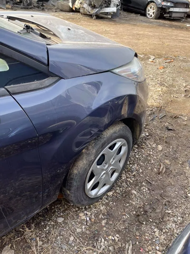Wrecked Ford Fiesta in the yard: collision cars supply straight factory wheels from their undamaged corners